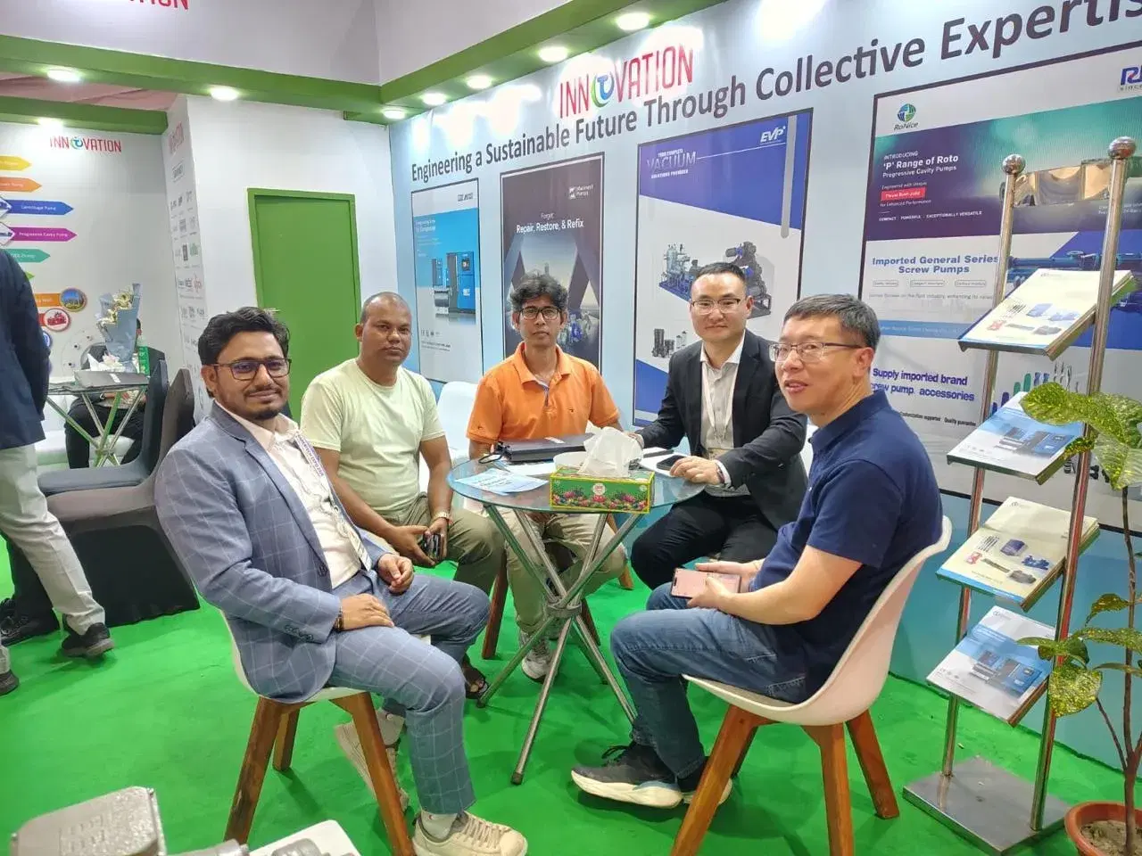 Discussion with partners and visitors seated at the exhibition stand