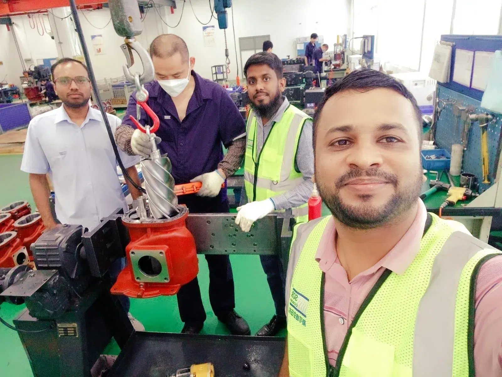 Screw compressor airend being assembled on the factory floor
