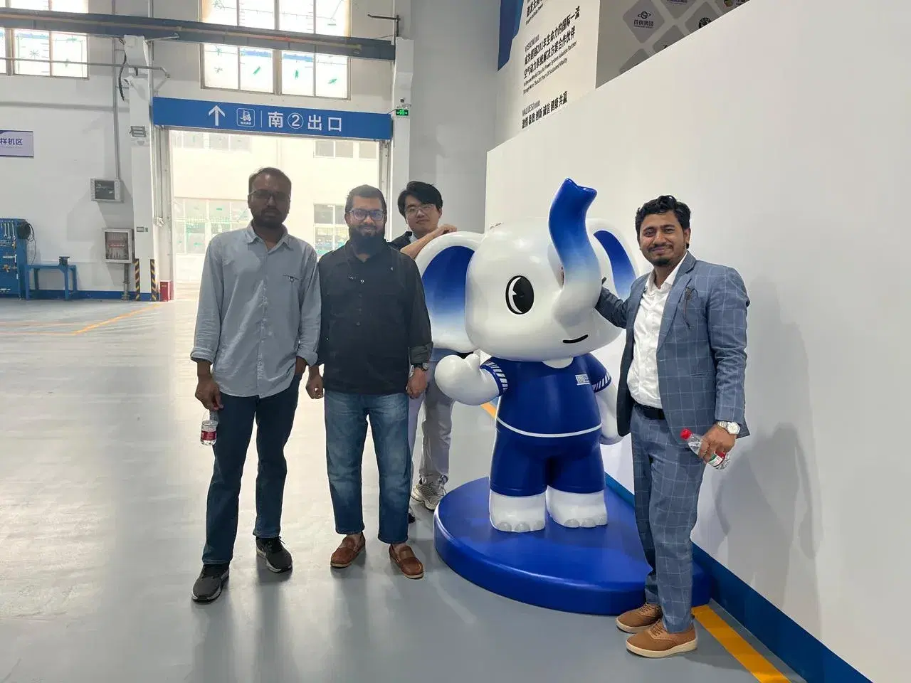 Team visiting a compressor manufacturing facility overseas