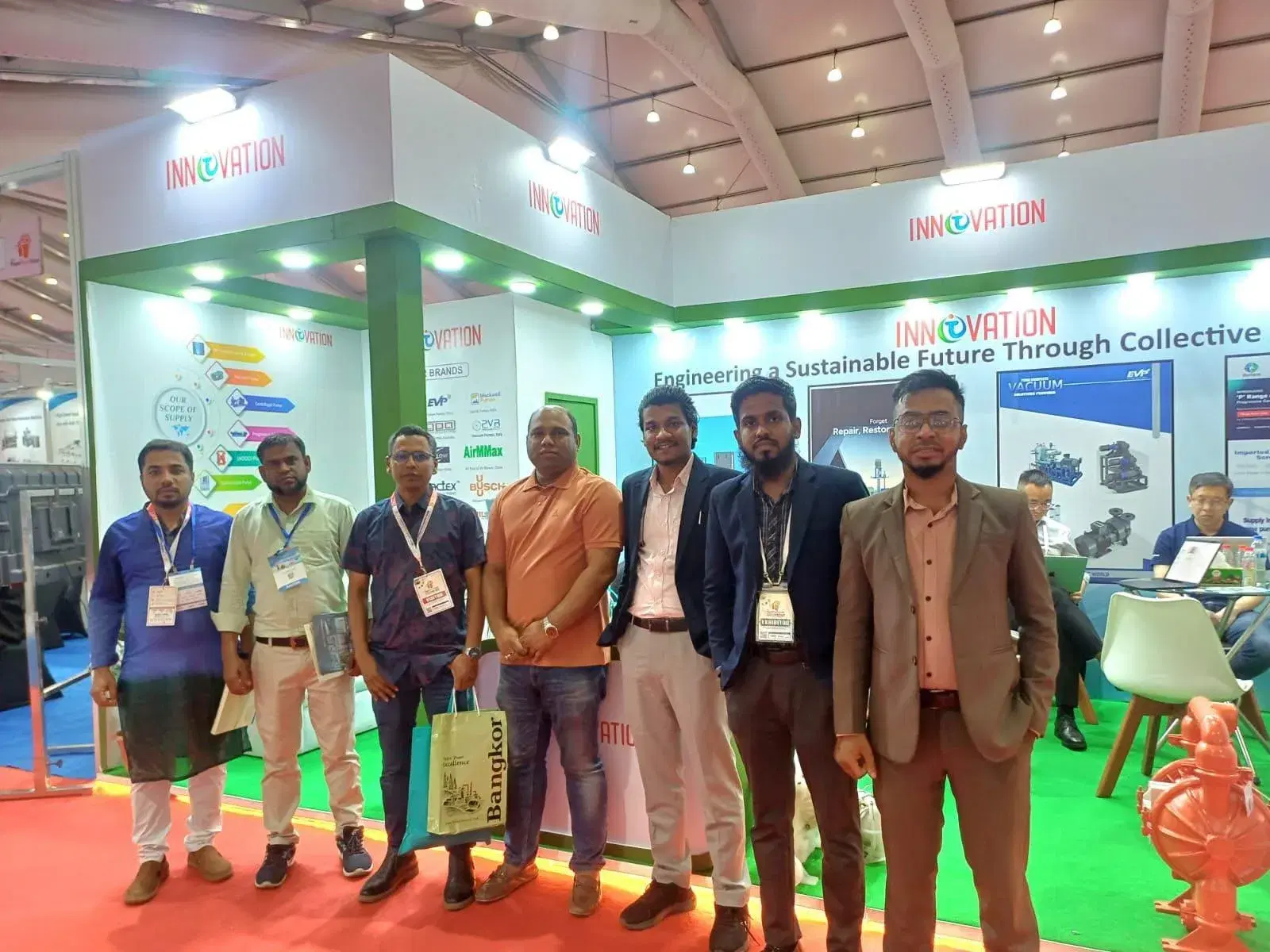 Group photo of the Innovation Nexus team at the exhibition stand