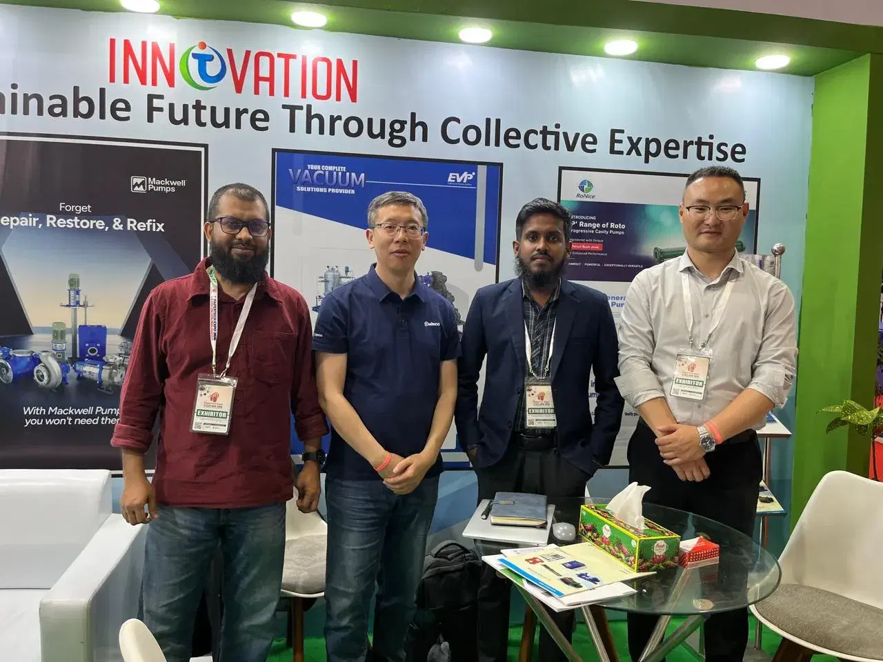 Innovation Nexus team with overseas partners at an exhibition booth