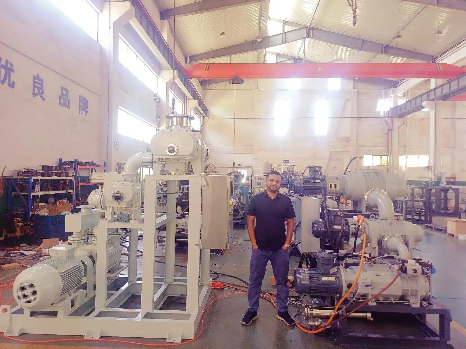 Vacuum pump packages under assembly in a manufacturing hall